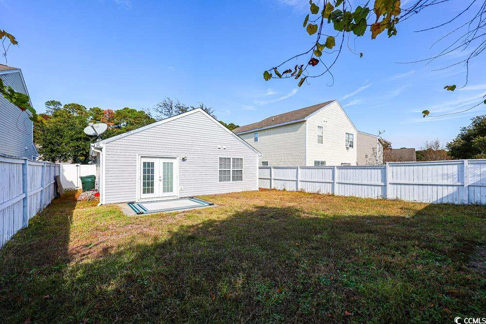 833 Silvercrest Drive Myrtle Beach, SC 29579 - Photo 24 of 30 Back of house with a fenced backyard, a patio area, and french doors