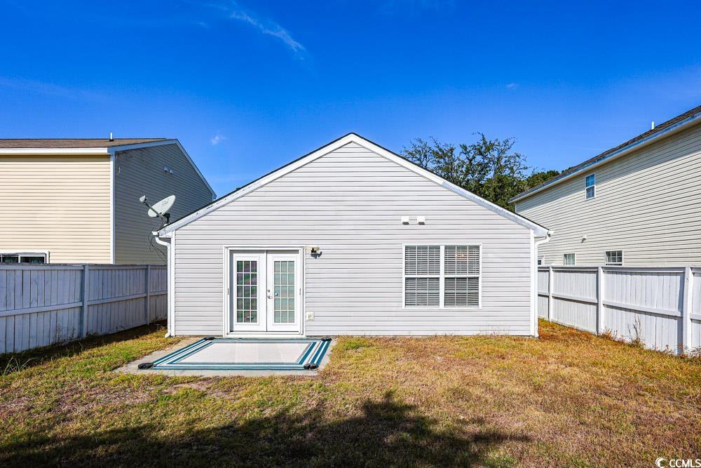 833 Silvercrest Drive Myrtle Beach, SC 29579 - Photo 25 of 30 Rear view of house featuring a fenced backyard, french doors, and a patio