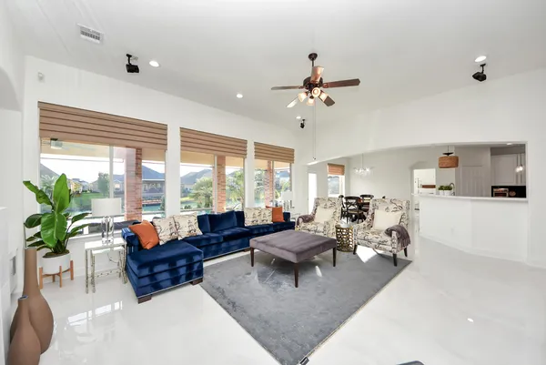a living room with furniture and a large window