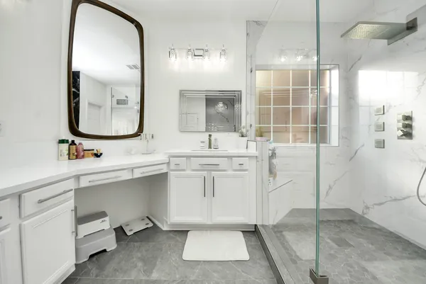 a bathroom with a sink and a mirror