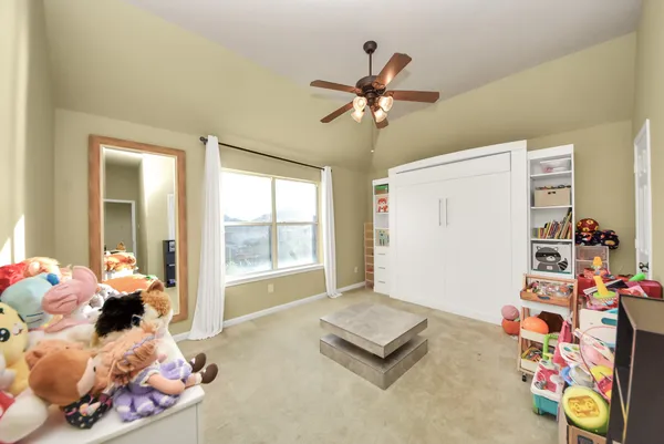 a living room with baby toys