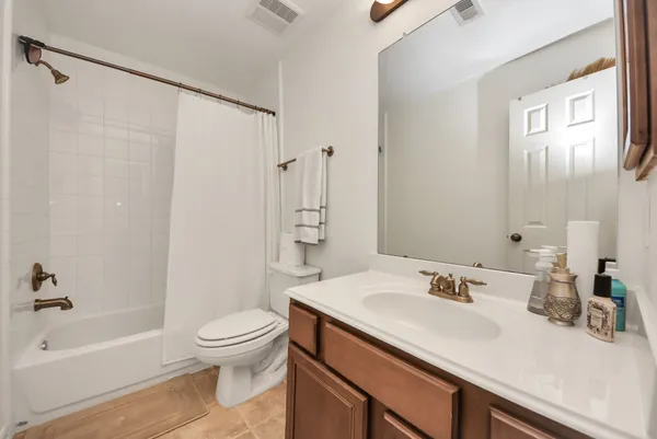 a bathroom with a sink a toilet and a bathtub