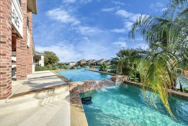 a view of a lake with a yard