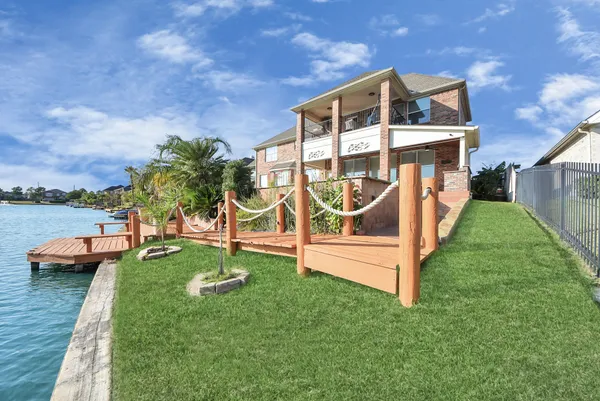 a front view of a house with a yard table and chairs