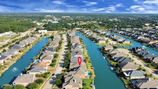 an aerial view of city and lake