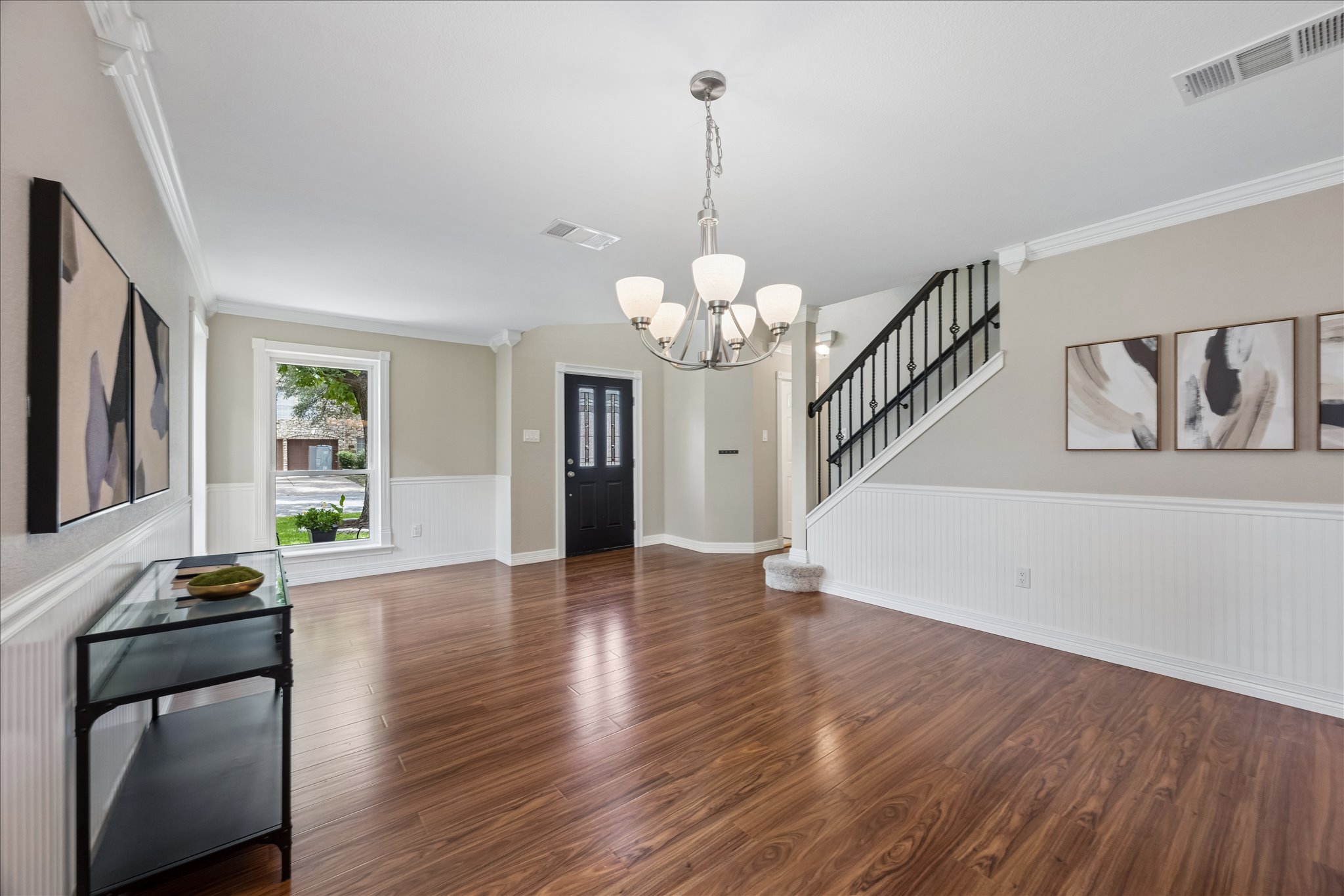 1306 Shady Grove Path Cedar Park, TX 78613 - Photo 6 of 40 a view of a room with wooden floor staircase and a chandelier