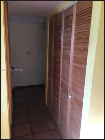 a kitchen with stainless steel appliances granite countertop a refrigerator and a stove