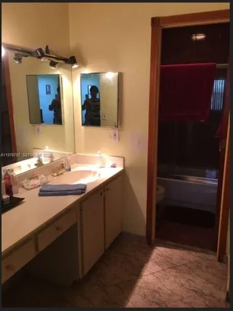 a bathroom with a toilet and a sink