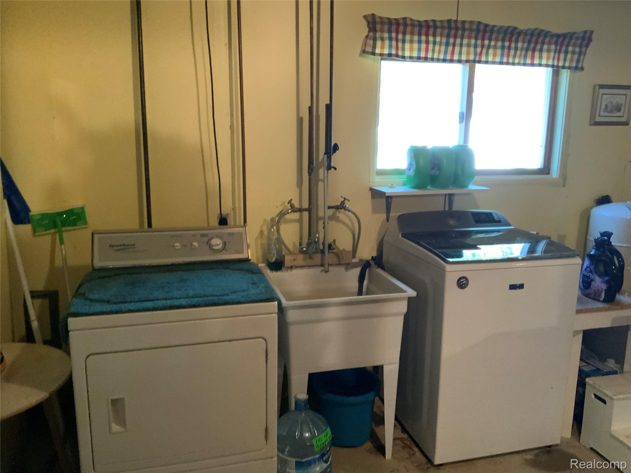 3828 Morgan Road Lake Orion, MI 48359 - Photo 22 of 39 Utility sink and a window with a valance