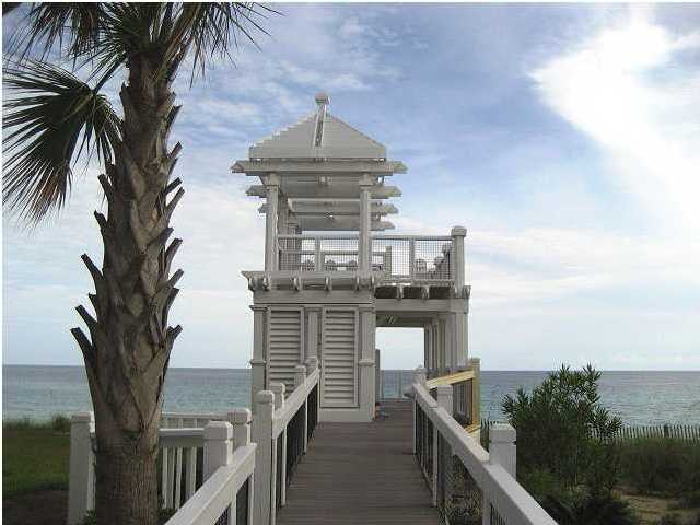 Lot 1 White Cliffs Boulevard Santa Rosa Beach, FL 32459 - Photo 3 of 11 a view of a terrace with a table and chairs under an umbrella