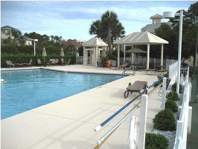 Lot 1 White Cliffs Boulevard Santa Rosa Beach, FL 32459 - Photo 6 of 11 a view of a house with pool and chairs