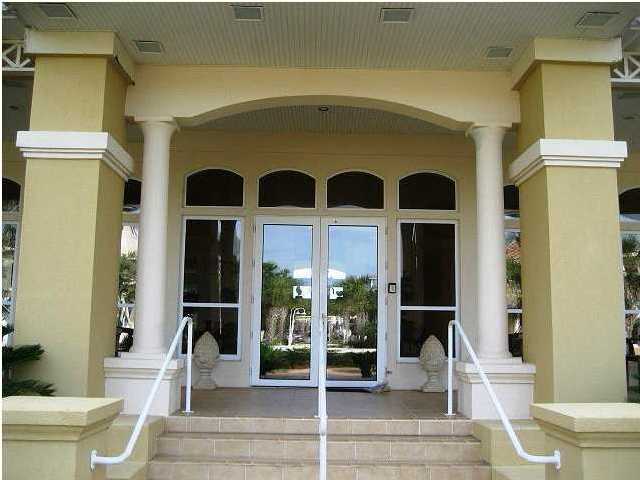 Lot 1 White Cliffs Boulevard Santa Rosa Beach, FL 32459 - Photo 7 of 11 a living room with a floor to ceiling window and wooden floor