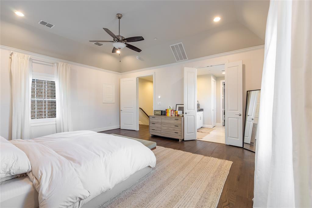 4116 Runyon Road Addison, TX 75001 - Photo 17 of 31 a bedroom with a bed and ceiling fan