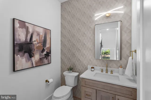 a kitchen with cabinets and stainless steel appliances