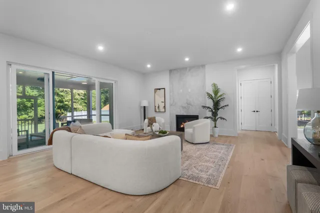 a kitchen with stainless steel appliances a sink a stove and cabinets
