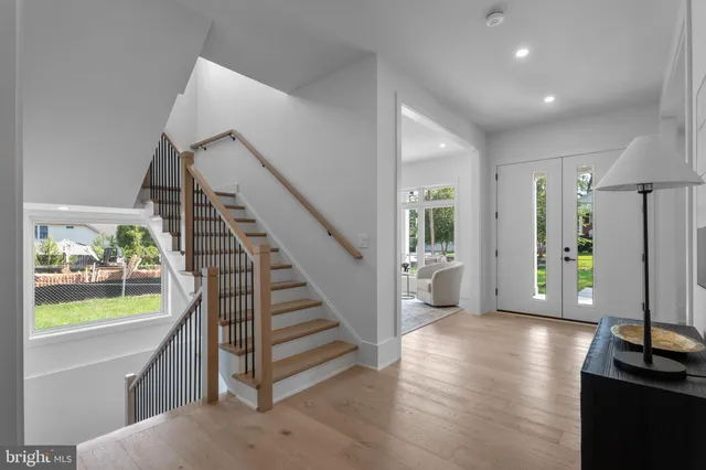 a very nice looking room with a large window and furniture