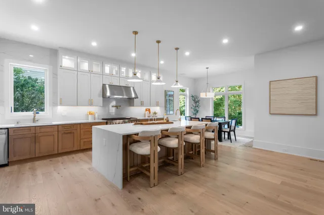 a spacious bedroom with a bed and a large window