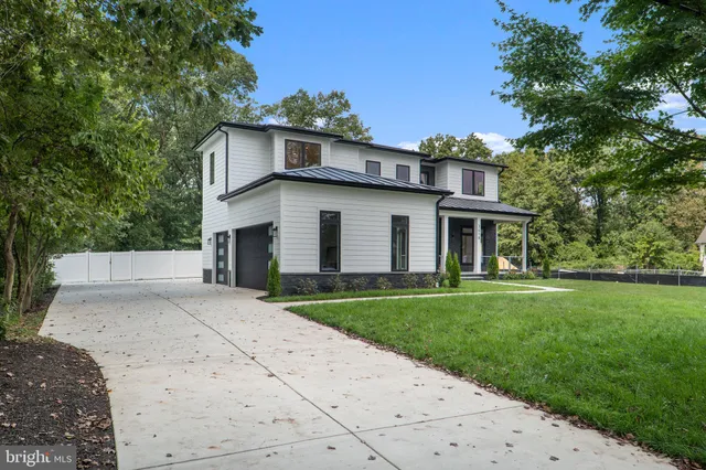 a view of a dining room with furniture and a chandelier