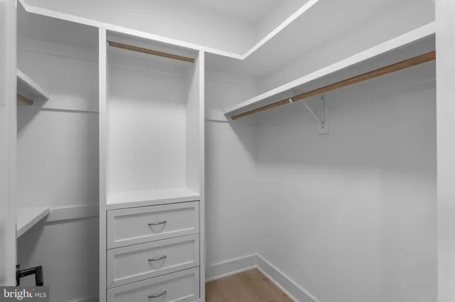 a view of an empty room and a fireplace