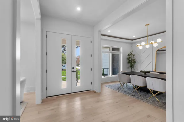 a bathroom with a toilet a sink and a mirror