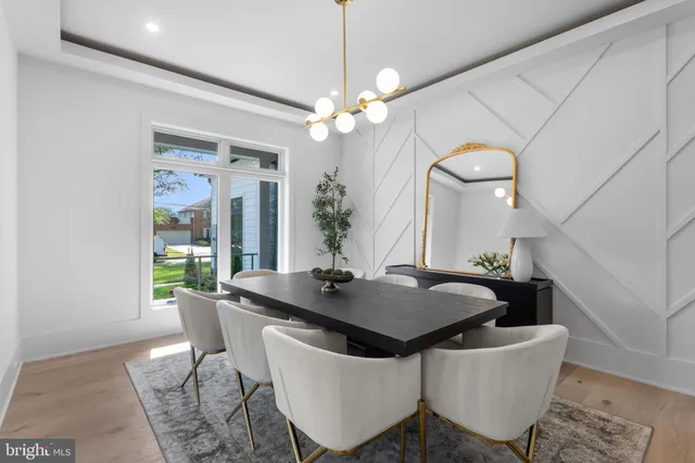 a living room with furniture potted plant and windows