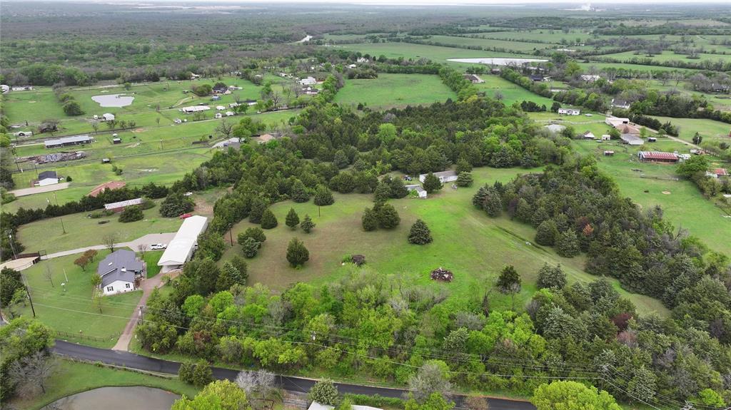 15530 Wiser Road Forney, TX 75126 - Photo 2 of 6 an aerial view of residential houses with outdoor space and trees