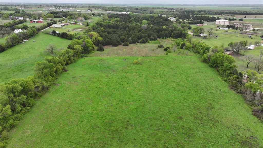 15530 Wiser Road Forney, TX 75126 - Photo 6 of 6 an aerial view of residential houses with outdoor space and trees