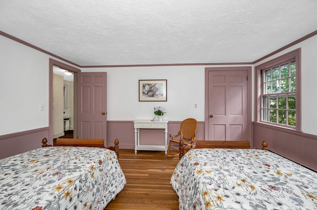 8 Greenwood Road Reading, MA 01867 - Photo 20 of 39 a bedroom with a bed and a window