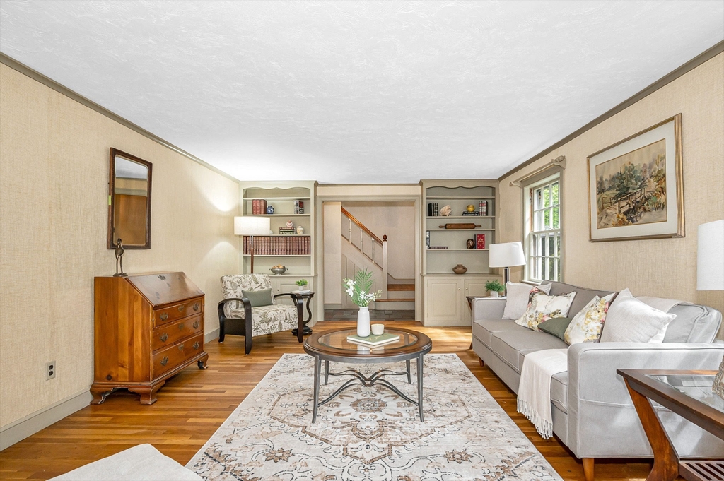 8 Greenwood Road Reading, MA 01867 - Photo 8 of 39 a living room with furniture a rug and a table