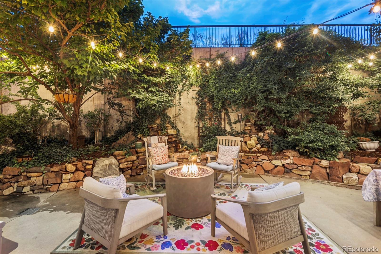 2000 Little Raven Street, Unit 1B Denver, CO 80202 - Photo 3 of 39 a view of a patio with couple of chairs and potted plants