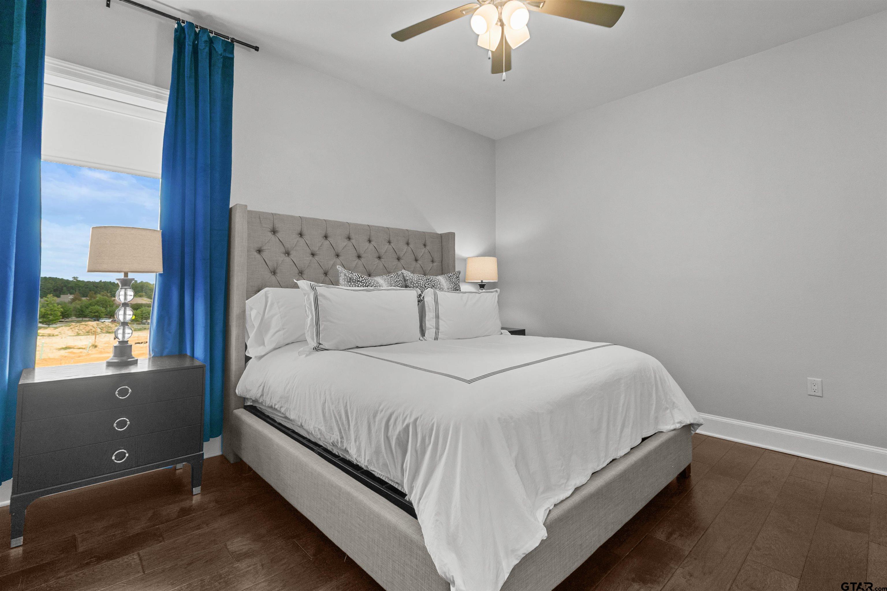 2981 Crest Ridge Drive, Unit 7 Tyler, TX 75703 - Photo 21 of 22 a bedroom with a bed and window