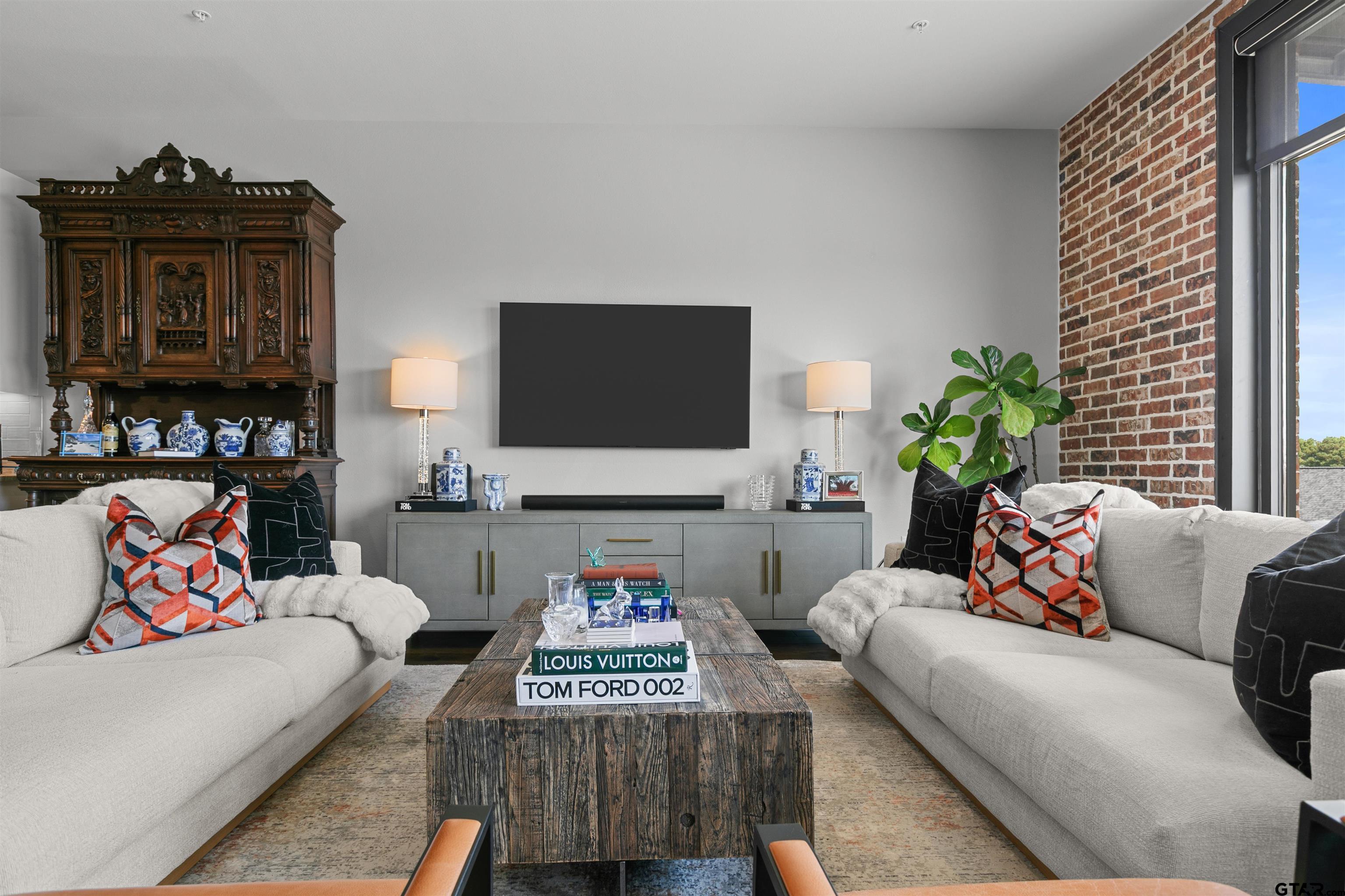 2981 Crest Ridge Drive, Unit 7 Tyler, TX 75703 - Photo 5 of 22 a living room with furniture and a flat screen tv