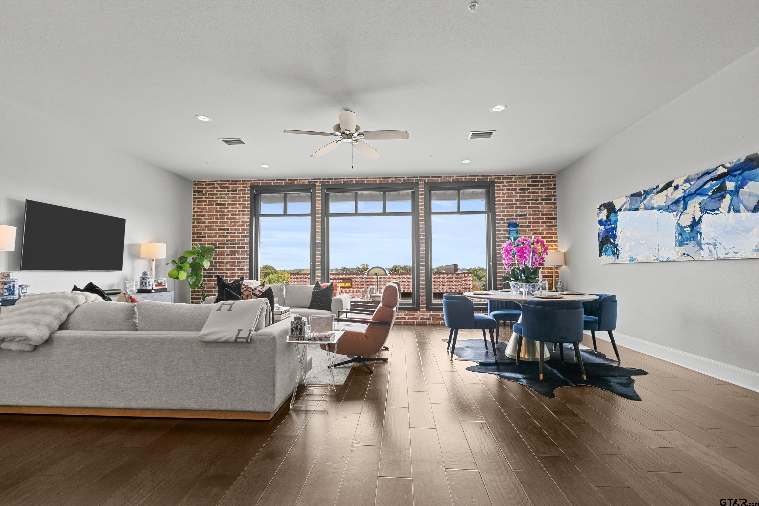 2981 Crest Ridge Drive, Unit 7 Tyler, TX 75703 - Photo 7 of 22 a living room with furniture and a flat screen tv