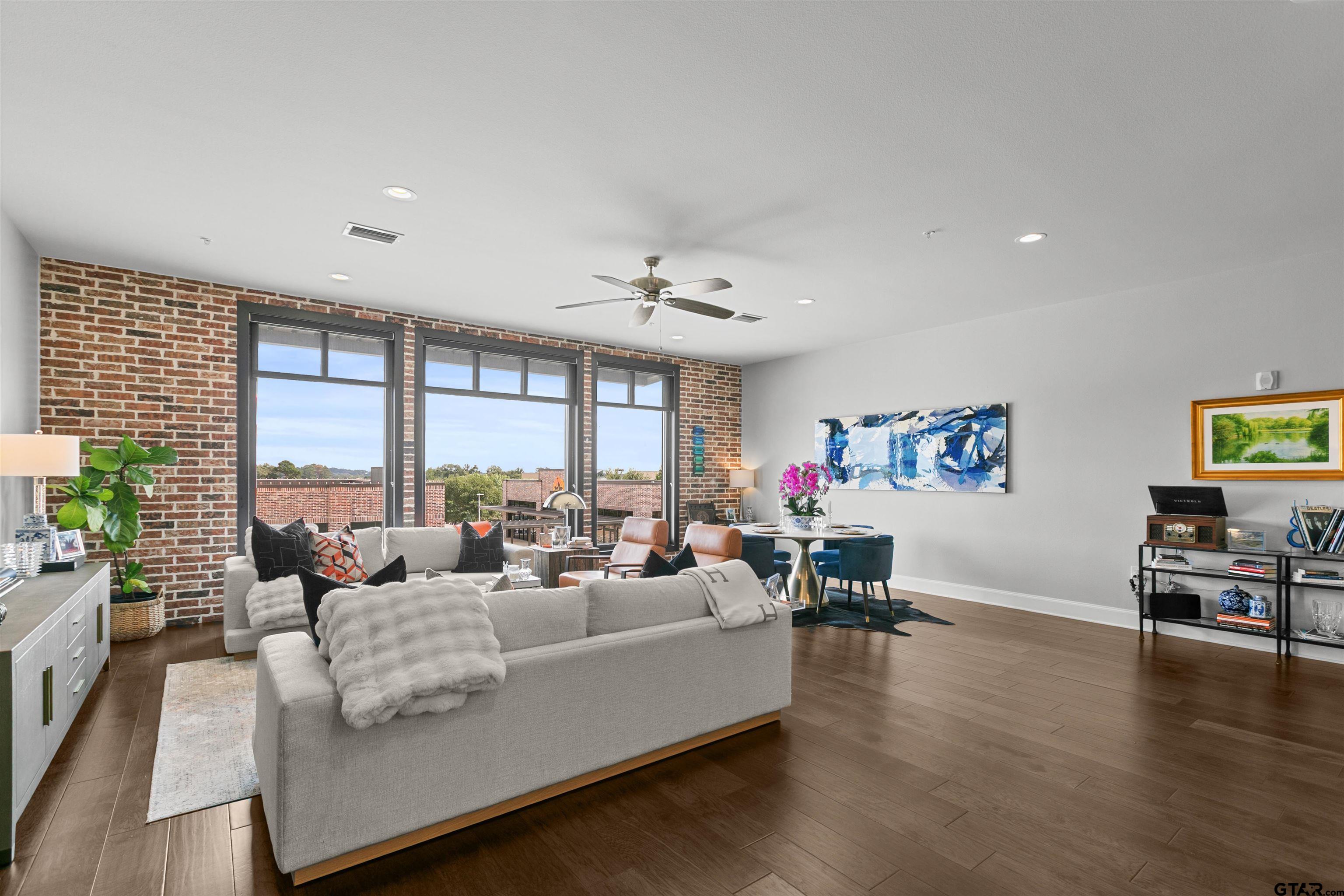 2981 Crest Ridge Drive, Unit 7 Tyler, TX 75703 - Photo 9 of 22 a living room with furniture and a large window