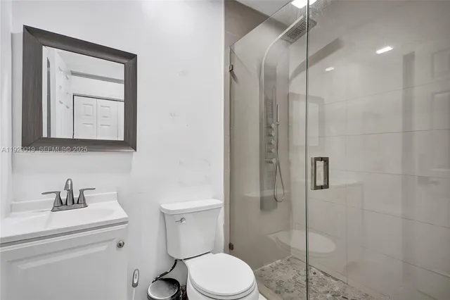 a bedroom with a bed and a potted plant