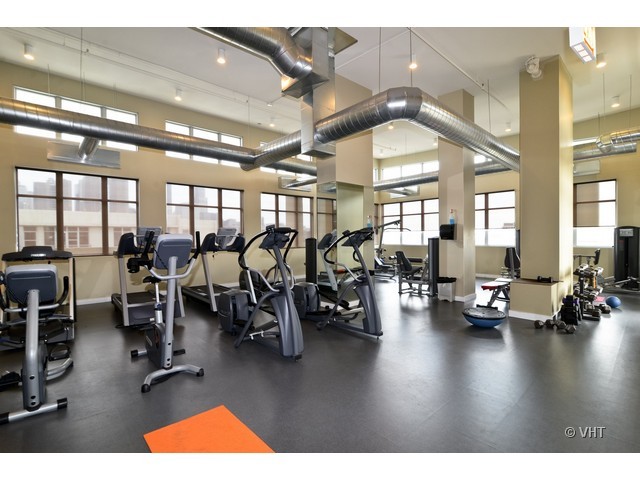 901 West Madison Street, Unit 809 Chicago, IL 60607 - Photo 10 of 12 a gym room with lots of gym equipment