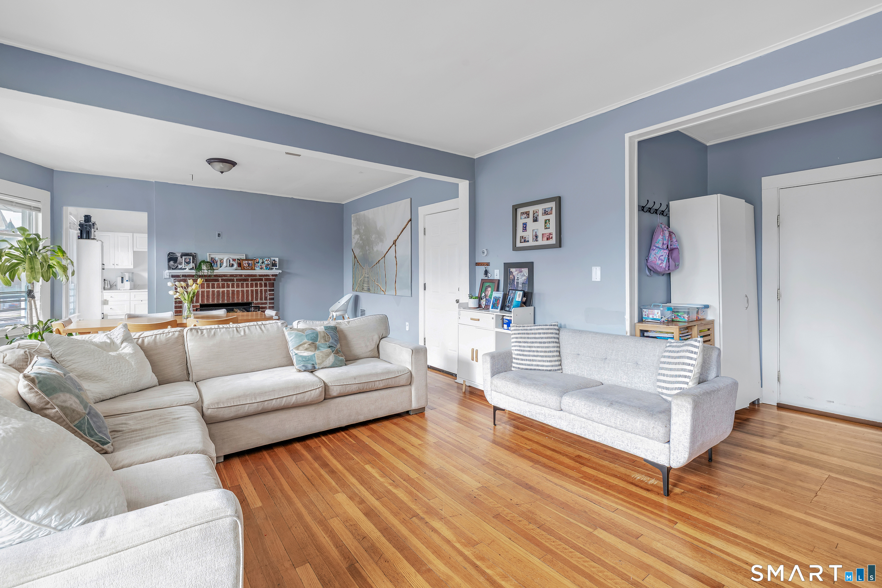 189 Wells Street Bridgeport, CT 06606 - Photo 8 of 40 2nd Floor - Offers 1389 sq ft -Shared LR & DR has operable wood burning fireplace, hardwood floors