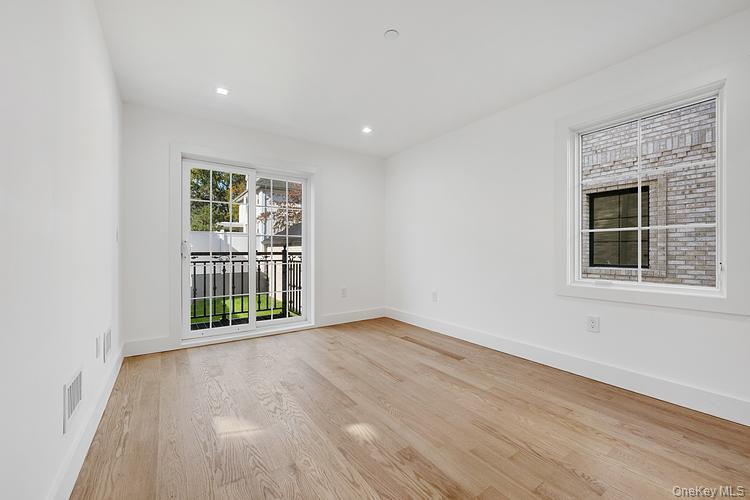 38-40 215th Street Queens, NY 11361 - Photo 22 of 35 Unfurnished room featuring light wood-style floors and recessed lighting