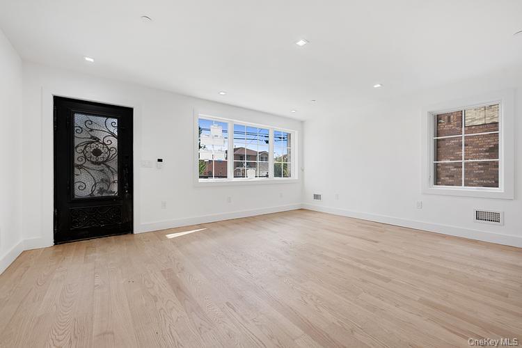 38-40 215th Street Queens, NY 11361 - Photo 27 of 35 Foyer entrance with light wood finished floors and recessed lighting