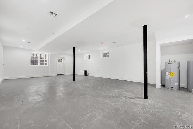 38-40 215th Street Queens, NY 11361 - Photo 32 of 35 Basement with water heater