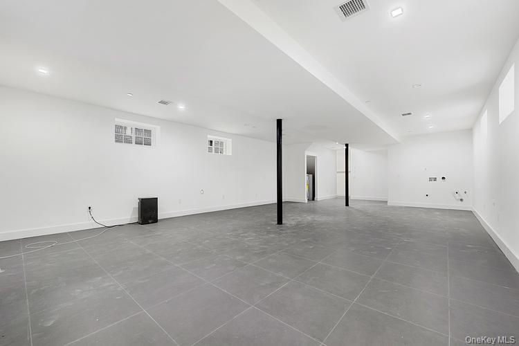 38-40 215th Street Queens, NY 11361 - Photo 33 of 35 Finished basement featuring recessed lighting and tile patterned floors