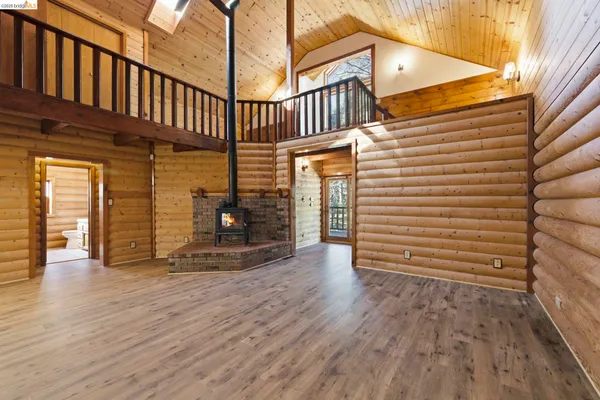 a view of a porch with wooden floor and stairs
