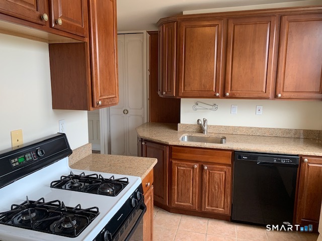 50 Glenbrook Road, Unit 5G Stamford, CT 06902 - Photo 27 of 40 a kitchen with a stove and a sink