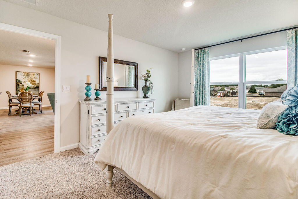 4425 Marine Loop Crestview, FL 32539 - Photo 20 of 33 a bedroom with a bed and a large window