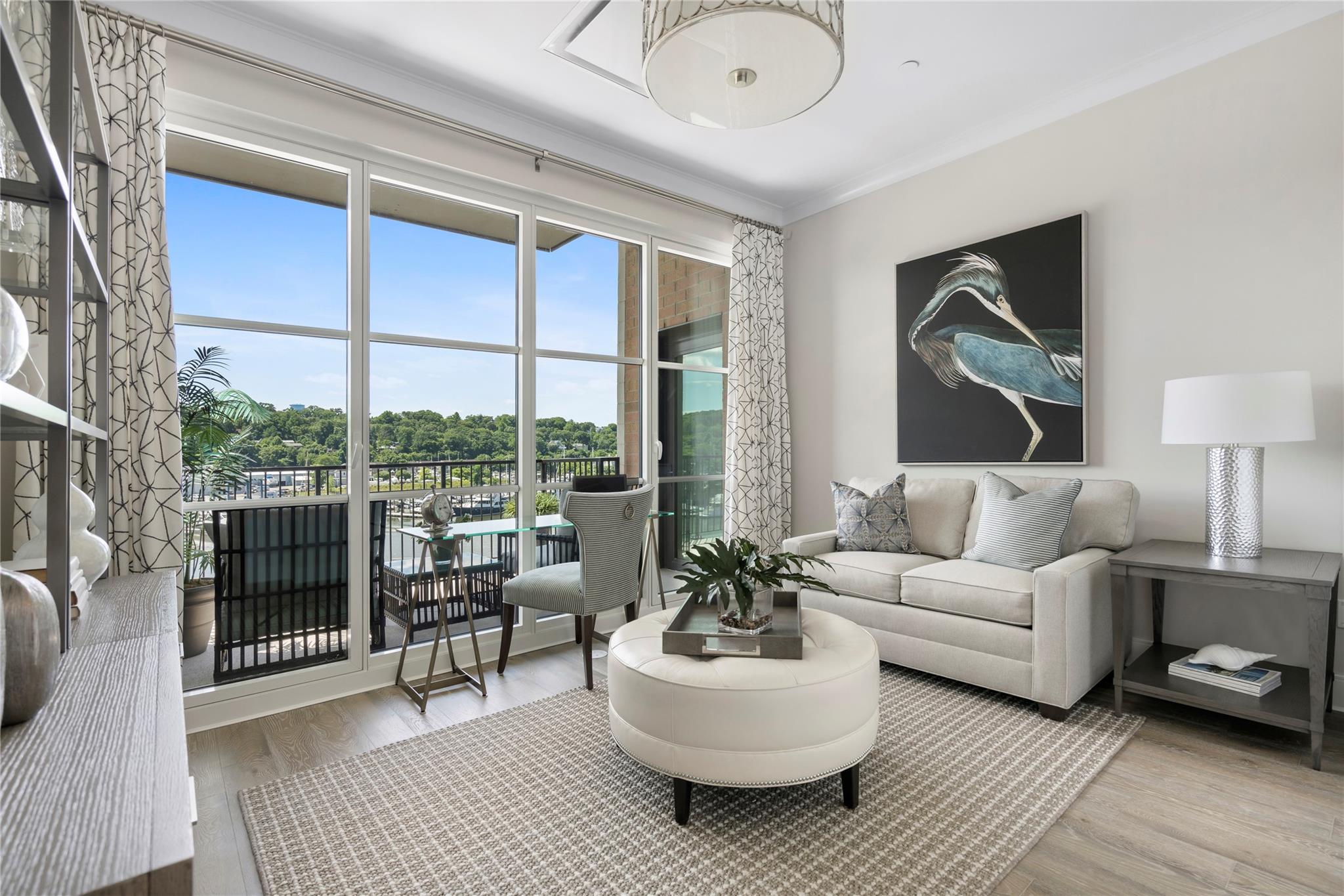 100 Garvies Point Road, Unit 1211 Glen Cove, NY 11542 - Photo 11 of 24 Living room featuring crown molding and wood-type flooring