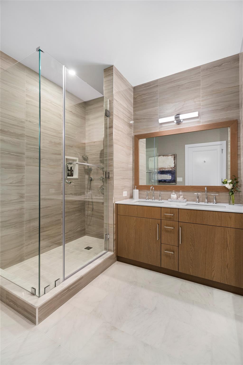 100 Garvies Point Road, Unit 1211 Glen Cove, NY 11542 - Photo 9 of 24 Bathroom with an enclosed shower, vanity, and tile walls