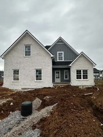 a front view of a house with sitting space