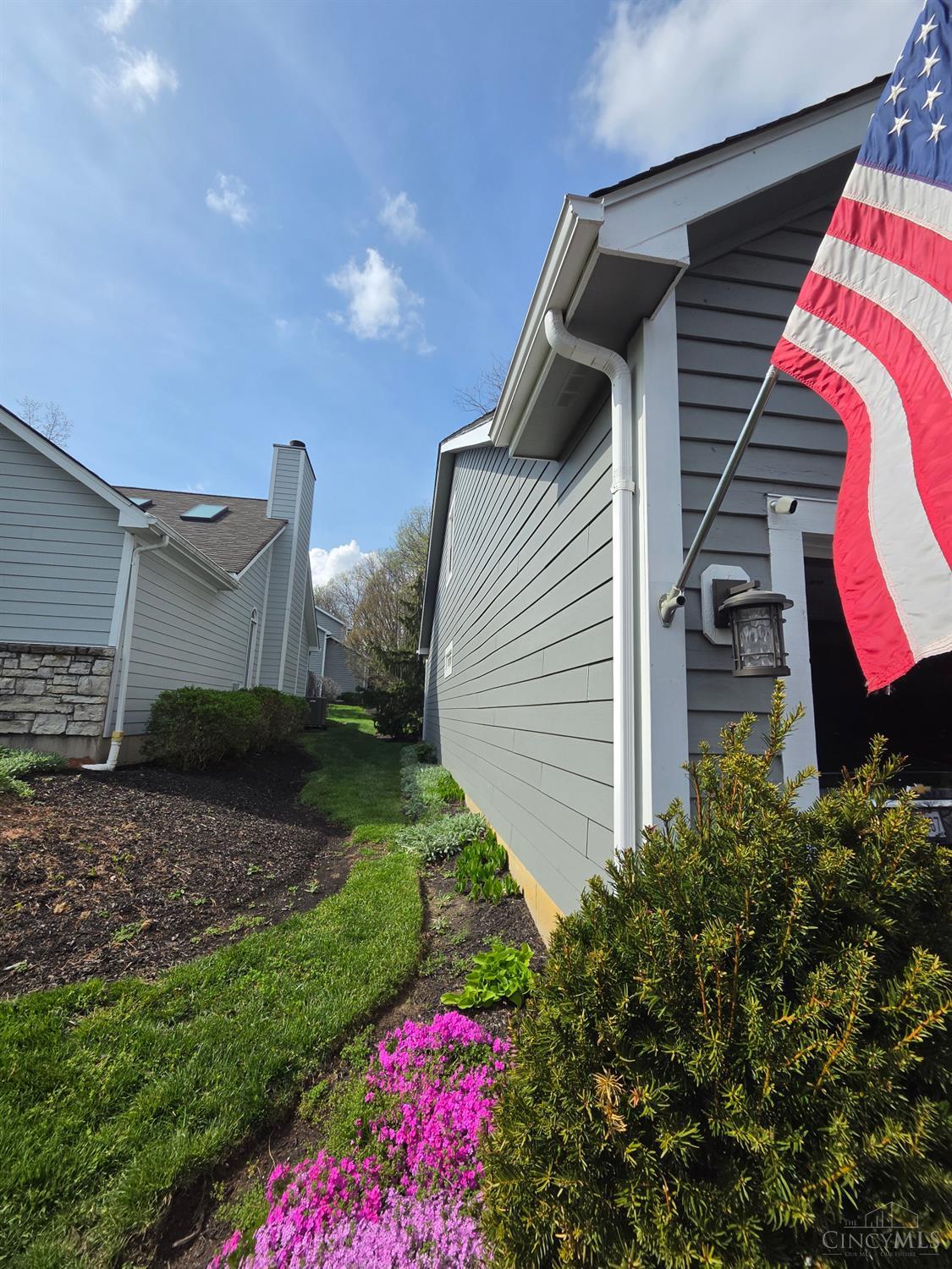 3444 Cutter Lane Maineville, OH 45039 - Photo 61 of 62 This whole left side is newer and is professionally installed low maintenance concrete siding! The seller has a contractor ready to install the same concrete siding for the top of the garage by closing if written in a offer.