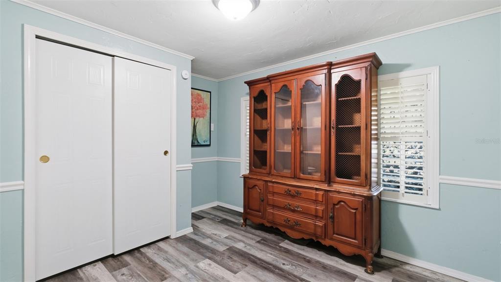 10565 Bessemer Street New Port Richey, FL 34654 - Photo 16 of 72 a view of front door with wooden floor