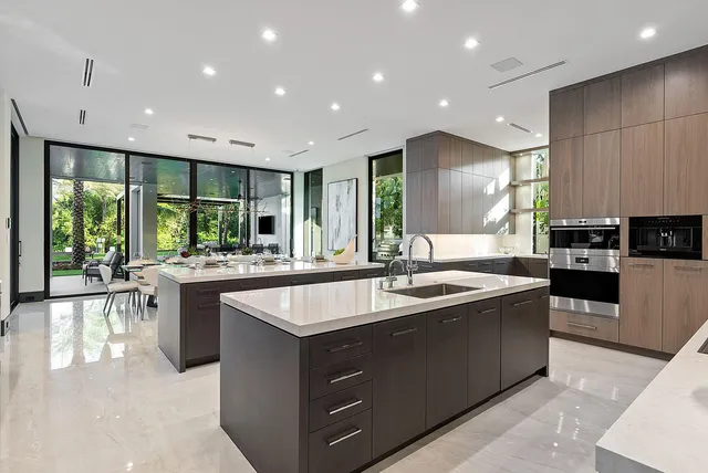 a spacious bathroom with a double vanity sink toilet and shower